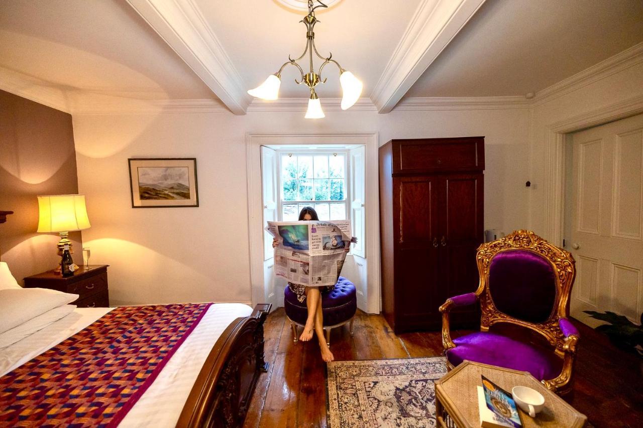 Clone Country House Aughrim Extérieur photo A guest reading the Irish Times in the hotel